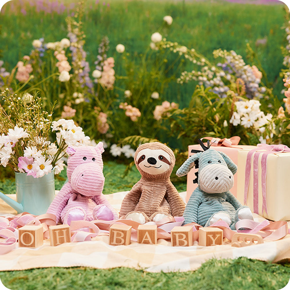 Image 102: my first warmies trio pig, sloth, and donkey in garden picnic setting